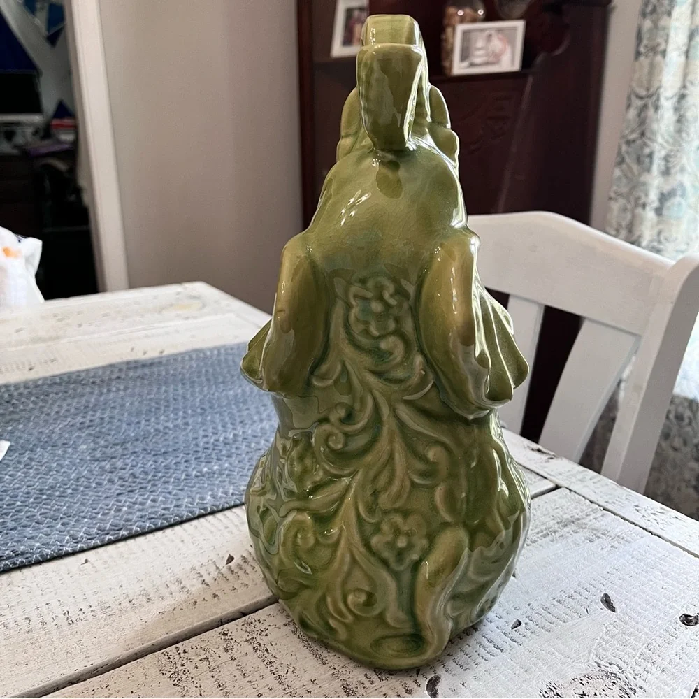 Elephant ceramic- Green Glaze Sitting with Floral Design 10 1/2” euc